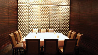 A rectangular table set for 12 in a private banquet area at Hollywood Casino in St. Louis, Missouri.