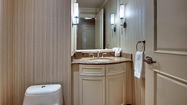 hotel bathroom with vanity and toilet