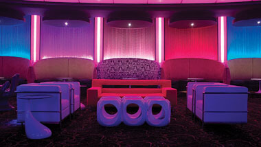 Multi-colored chairs and sofas inside Boogie Nights night club at Hollywood Casino in St. Louis, Missouri.