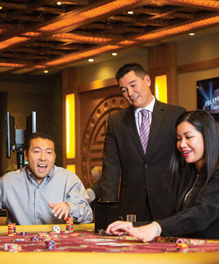 Players cheer a win in the Phat Tai gaming room at Hollywood Casino in St. Louis, Missouri.