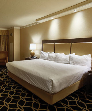 The king-size bed inside the Rodeo King hotel room at Hollywood Casino hotel in St. Louis, Missouri.