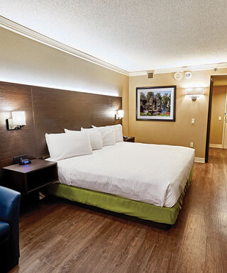 The king bed inside the Sunset King hotel room at Hollywood Casino hotel in St. Louis, Missouri.