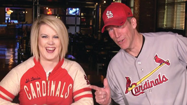 guy and girl from as seen on social wearing St. Louis Cardinals gear