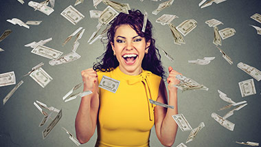 Girl with money flying around her