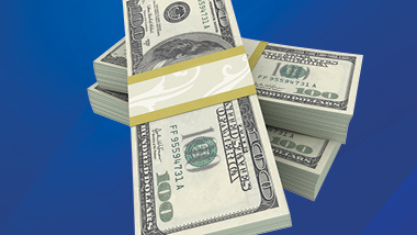 Stacks of $100 bills on a dark blue background.