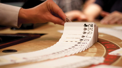 dealer shuffling cards