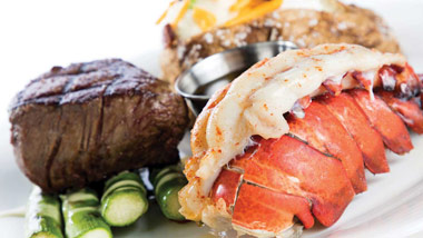 filet with lobster tail, baked potato and asparagus